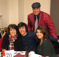 Chris Wenzler receiving University Heights Good Neighbor Award: with Melissa, Oliver, and Madeline